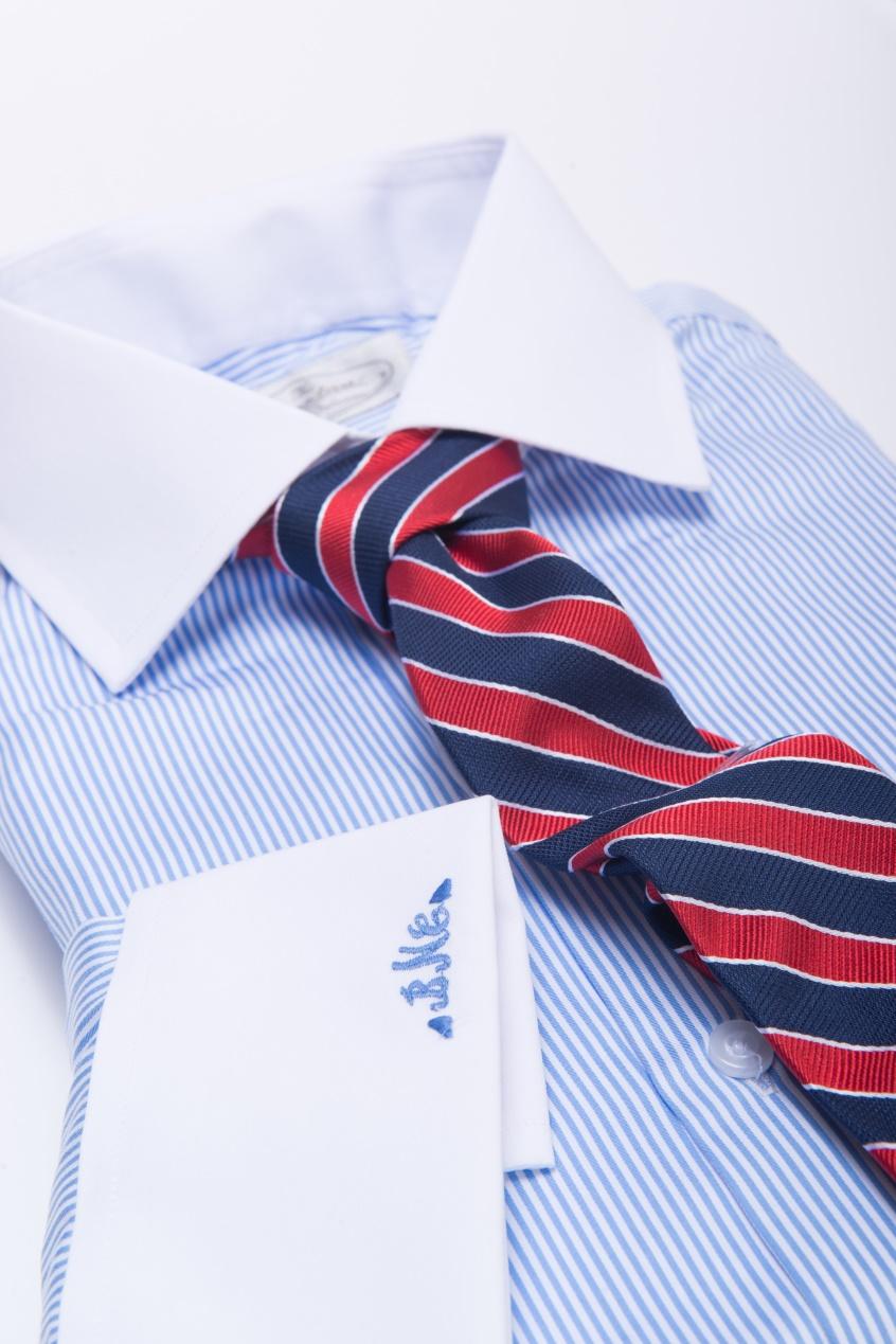 The Dark Knot’s Canterbury Regimental Stripes Navy w/ Red Tie against a Blue Shirt provides for a triadic color scheme, with a harmonious balance of warm and cool colors. This helps to create visual pop.