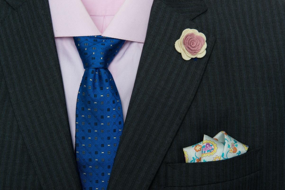 The Dark Knot’s Montpelier Abstract Blue Tie against a light pink shirt provides for a great sense of harmony within a triadic color scheme (as pink is a lighter variant of red).