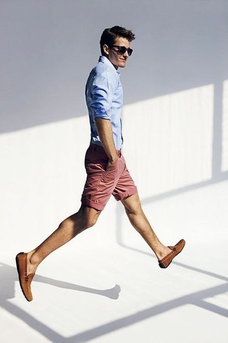 summer clothes for men - nantucket red shorts with a light blue button up shirt sunglasses and brown loafers