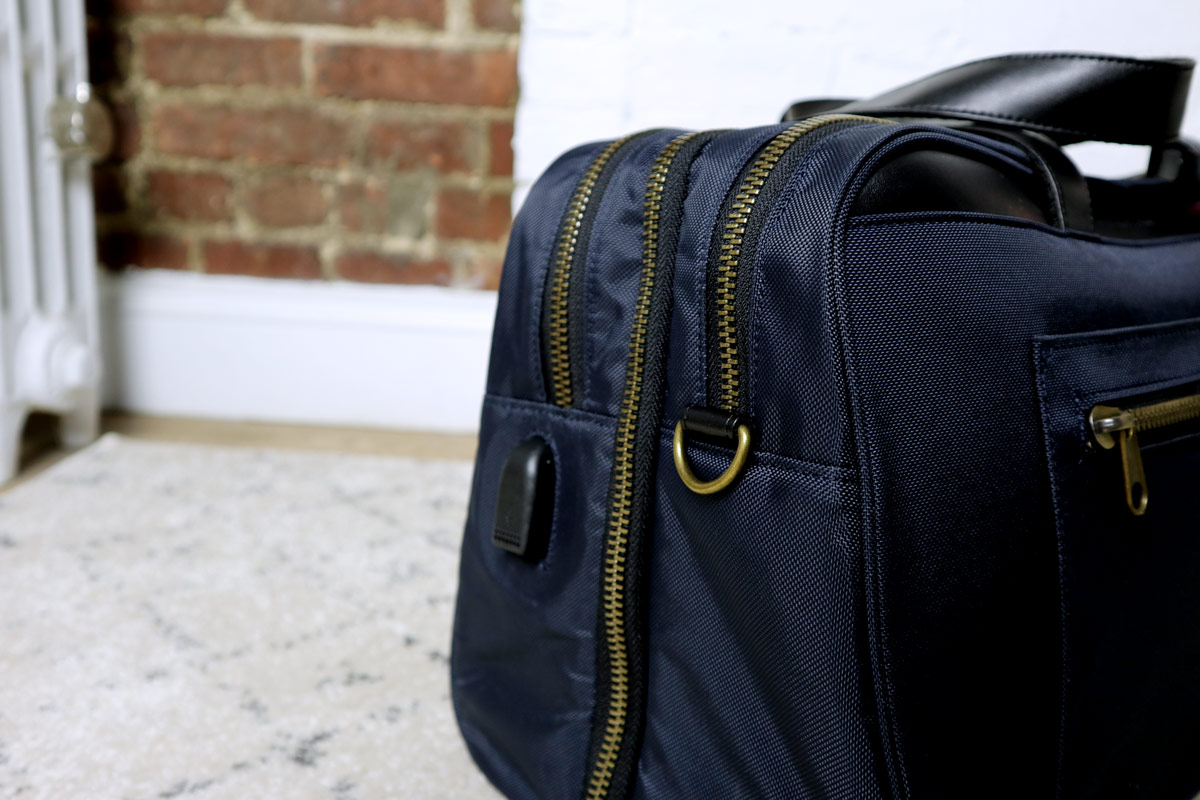closeup of USB charger port - best travel bag for men - nomad lane bento bag