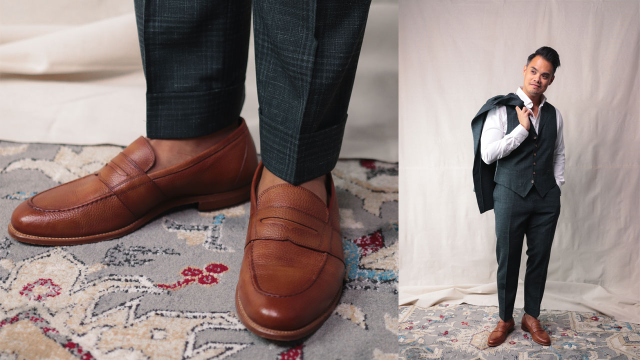 tan leather loafers with dark green three piece suit