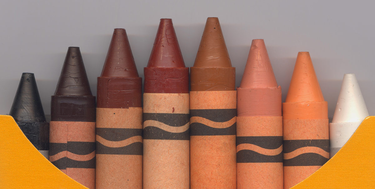 closeup of box of crayons with all skin tones