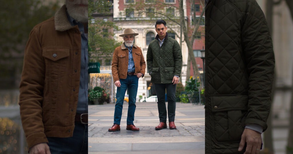man with beard wearing brown jacket and fedora with man wearing dark green jacket and brown boots