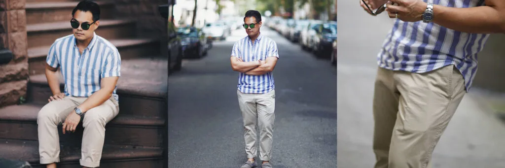 man wearing khaki chino pants and a blue and white stripe shirt with collar
