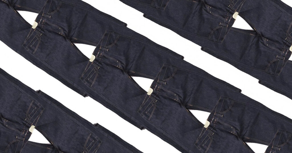 denim pants laid on top of each other in a diagonal row