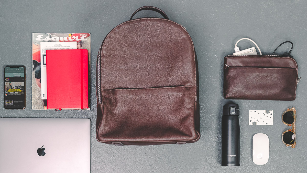 daveed leather backpack and travel pouch with everyday carry items and other men's accessories