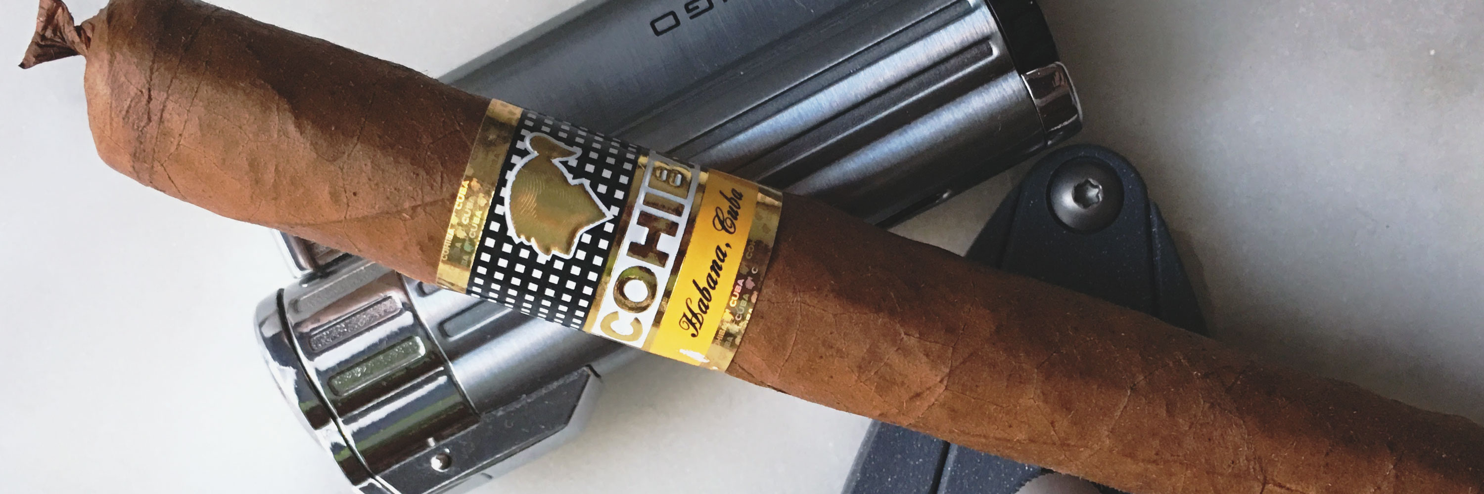 cohiba cigar with lighter and cutter