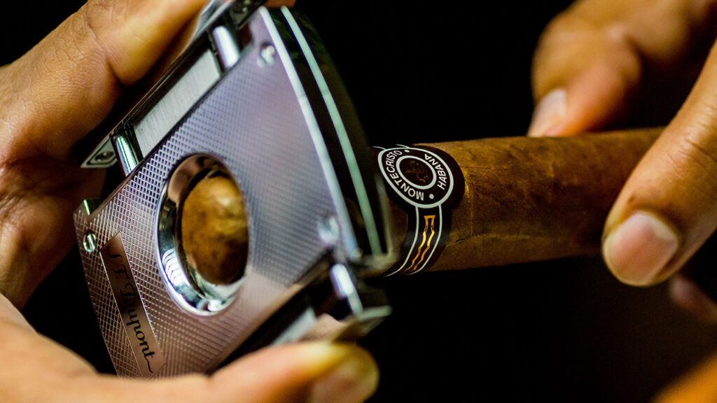 closeup of cigar cutter and cigar head