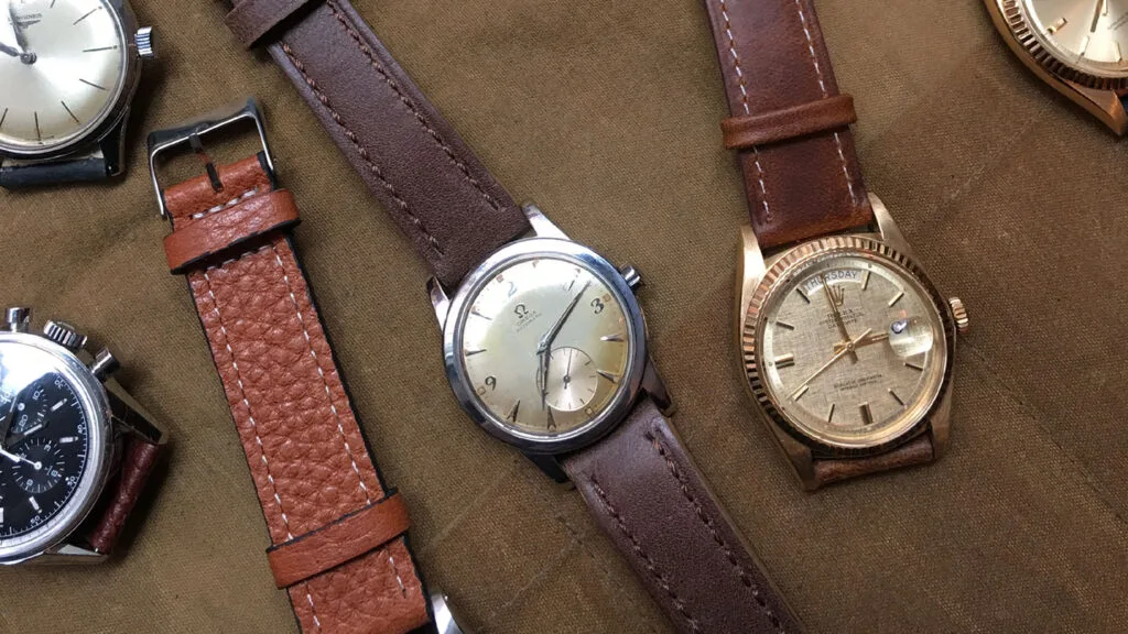 how to store watches - collection of vintage watches on canvas fabric