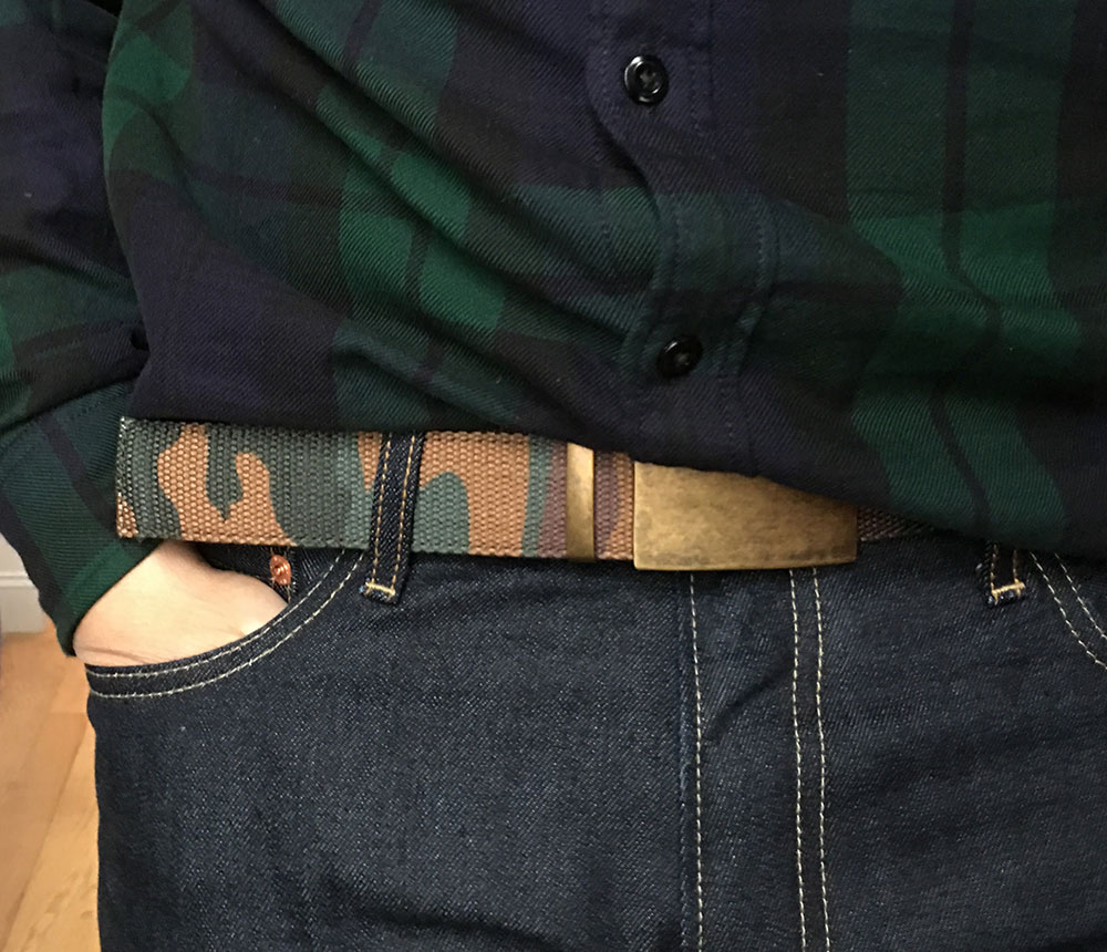 camo belt with black watch shirt and dark jeans