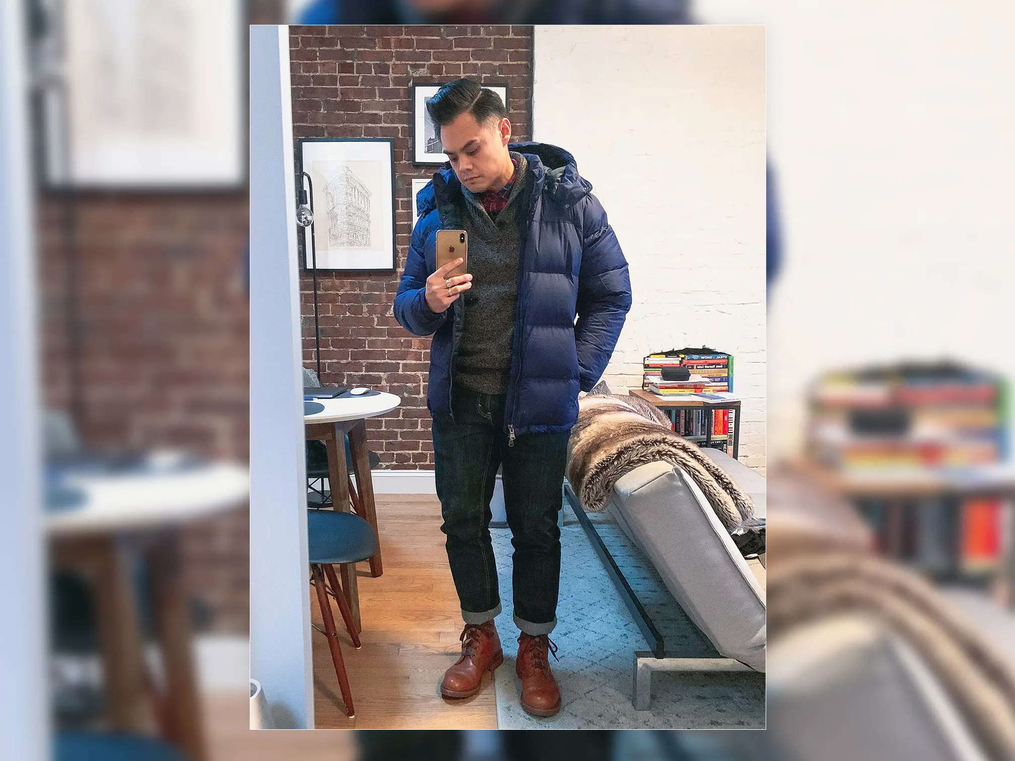 blue puffer jacket dark jeans and tan boots