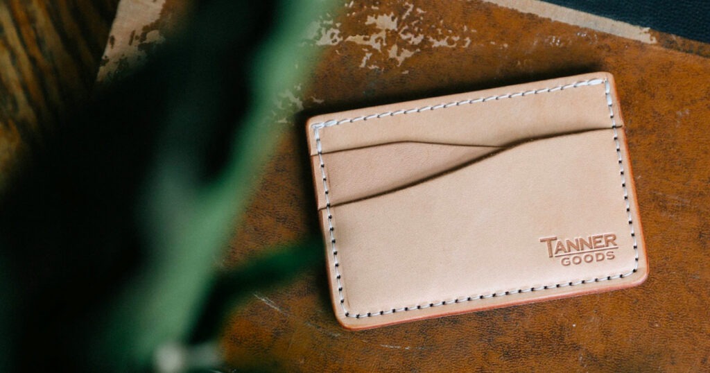 light colored leather cardholder on table