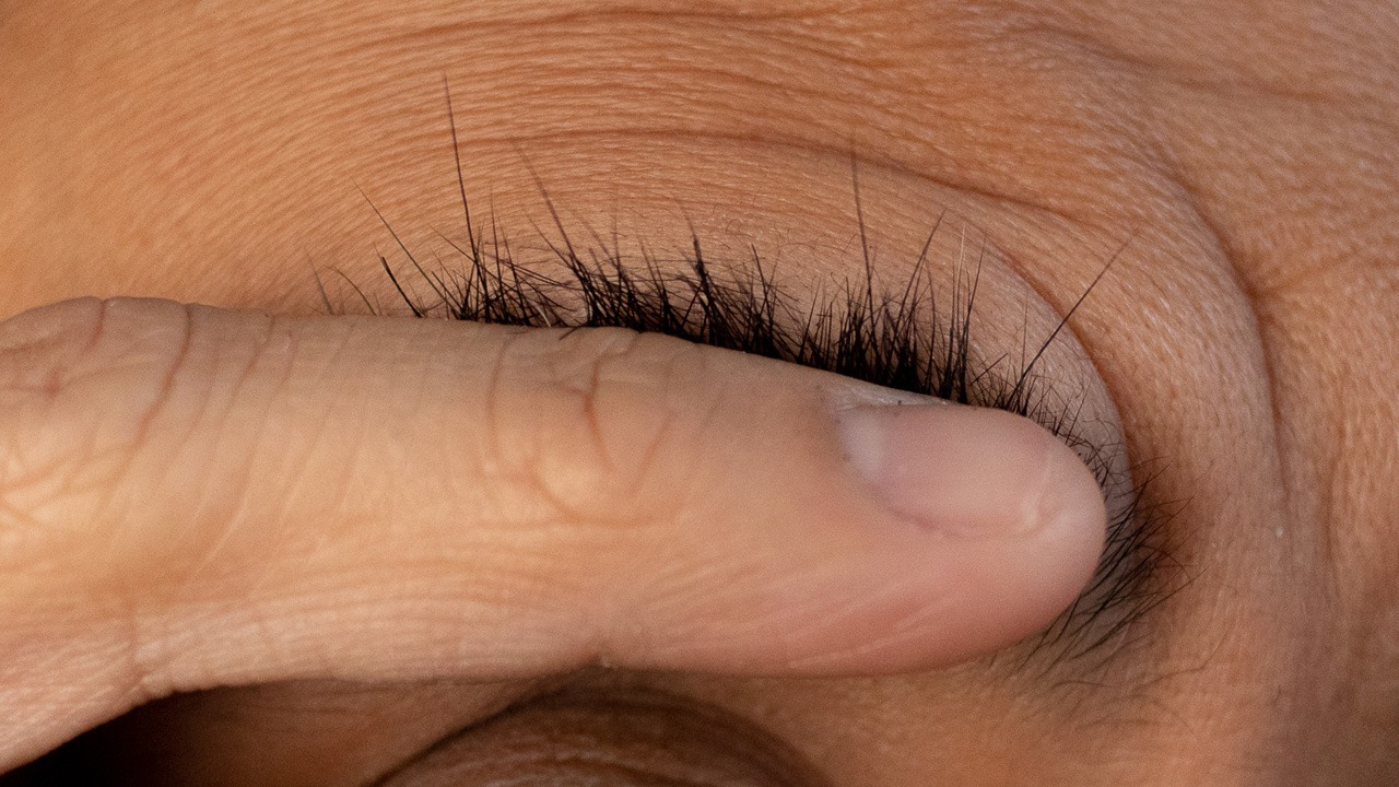 closeup of untrimmed eyebrow hairs