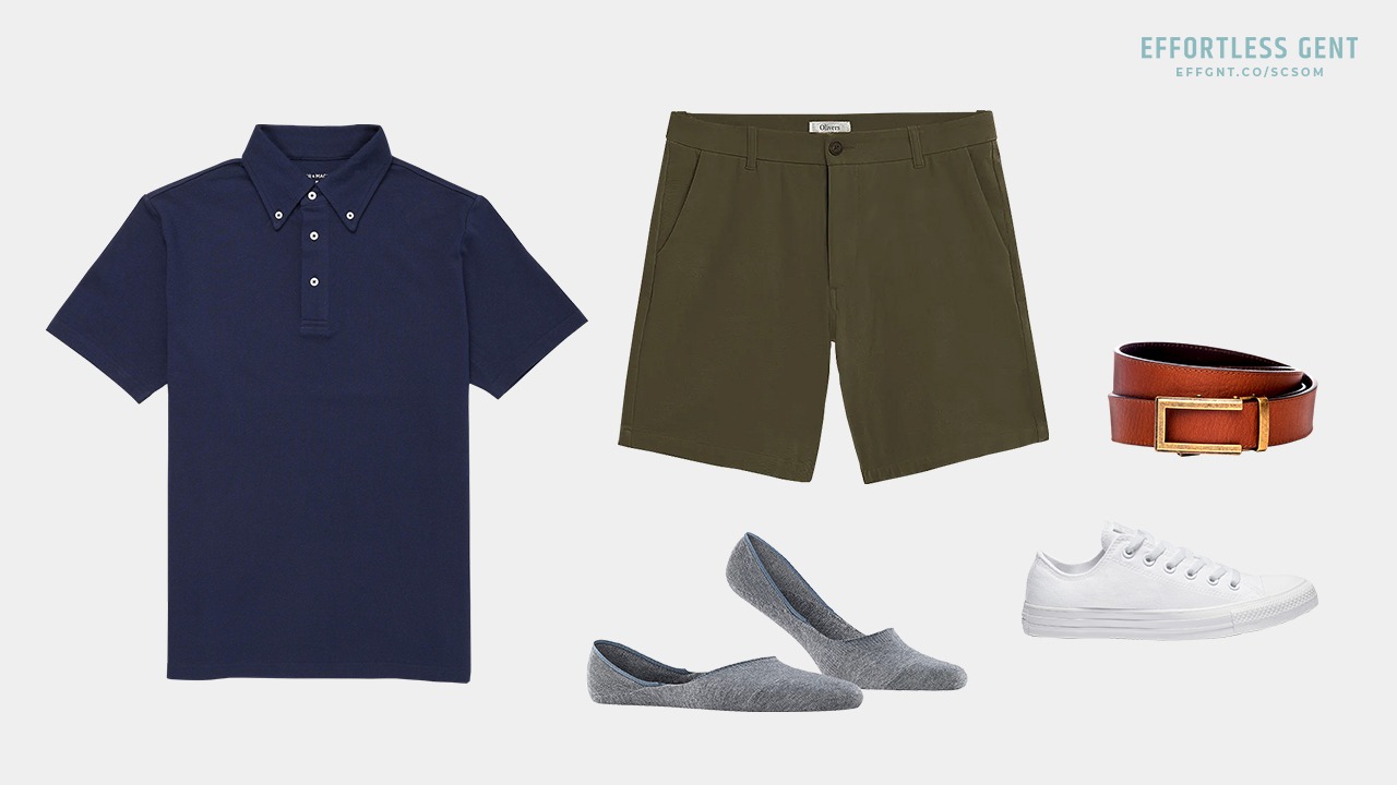 outfit flatlay with navy polo olive shorts no show socks white sneakers and tan belt