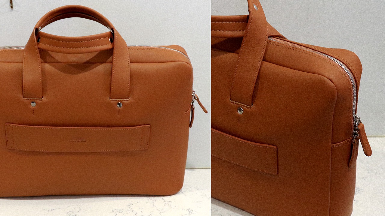 closeup and angle shot of tan leather briefcase bag