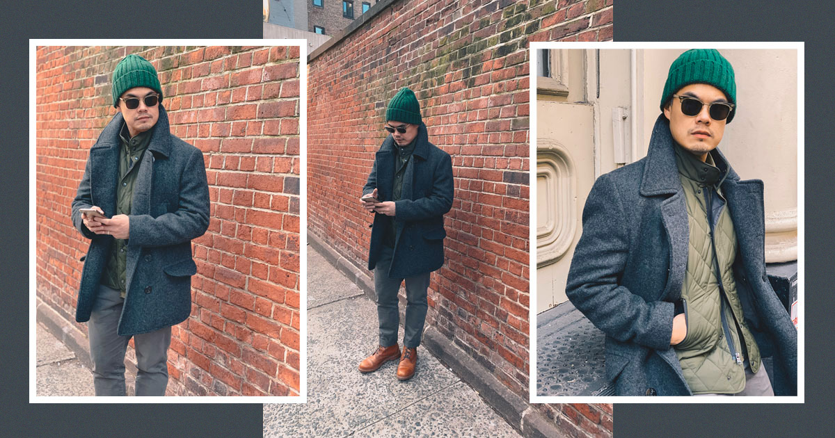 mens winter fashion example - grey pea coat over a quilted vest and a green beanie watchcap